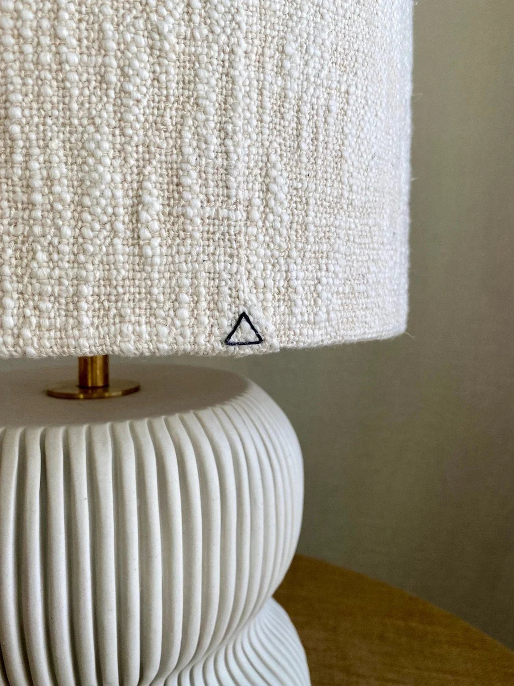 White table lamp with textured shade.