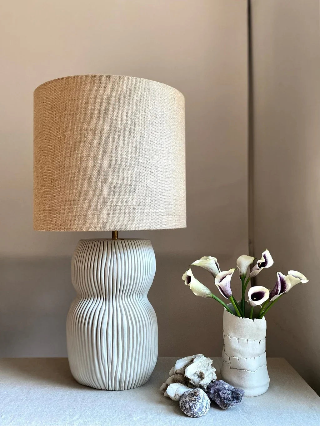 Table lamp and vase with flowers