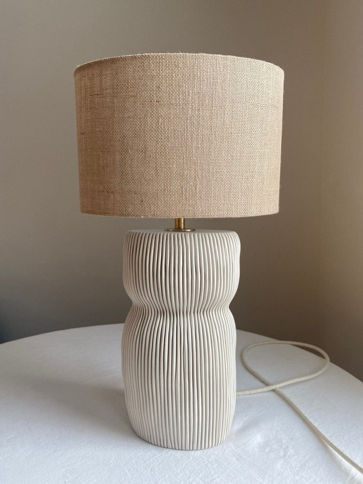 Beige table lamp with textured shade