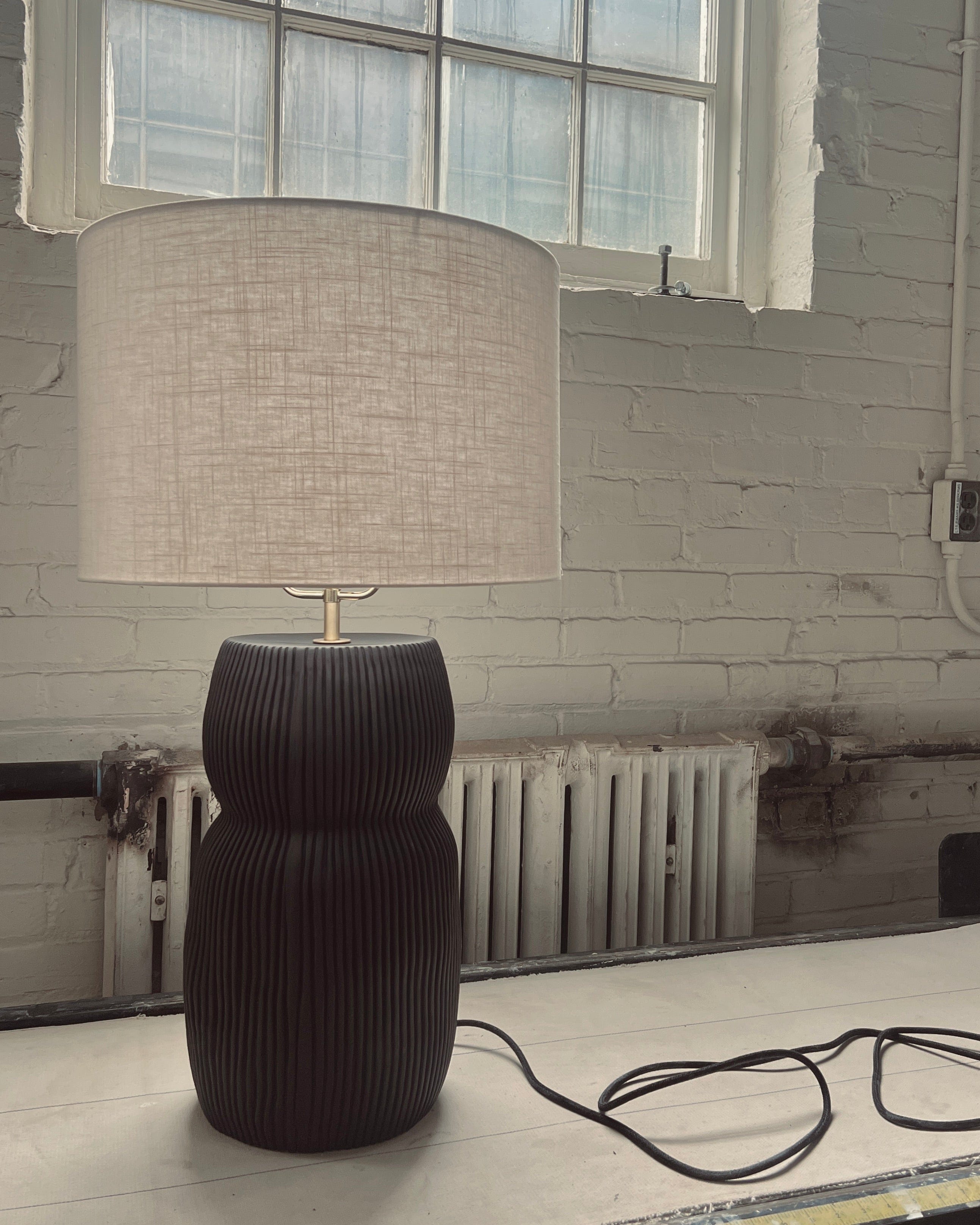 Modern black table lamp with linen shade