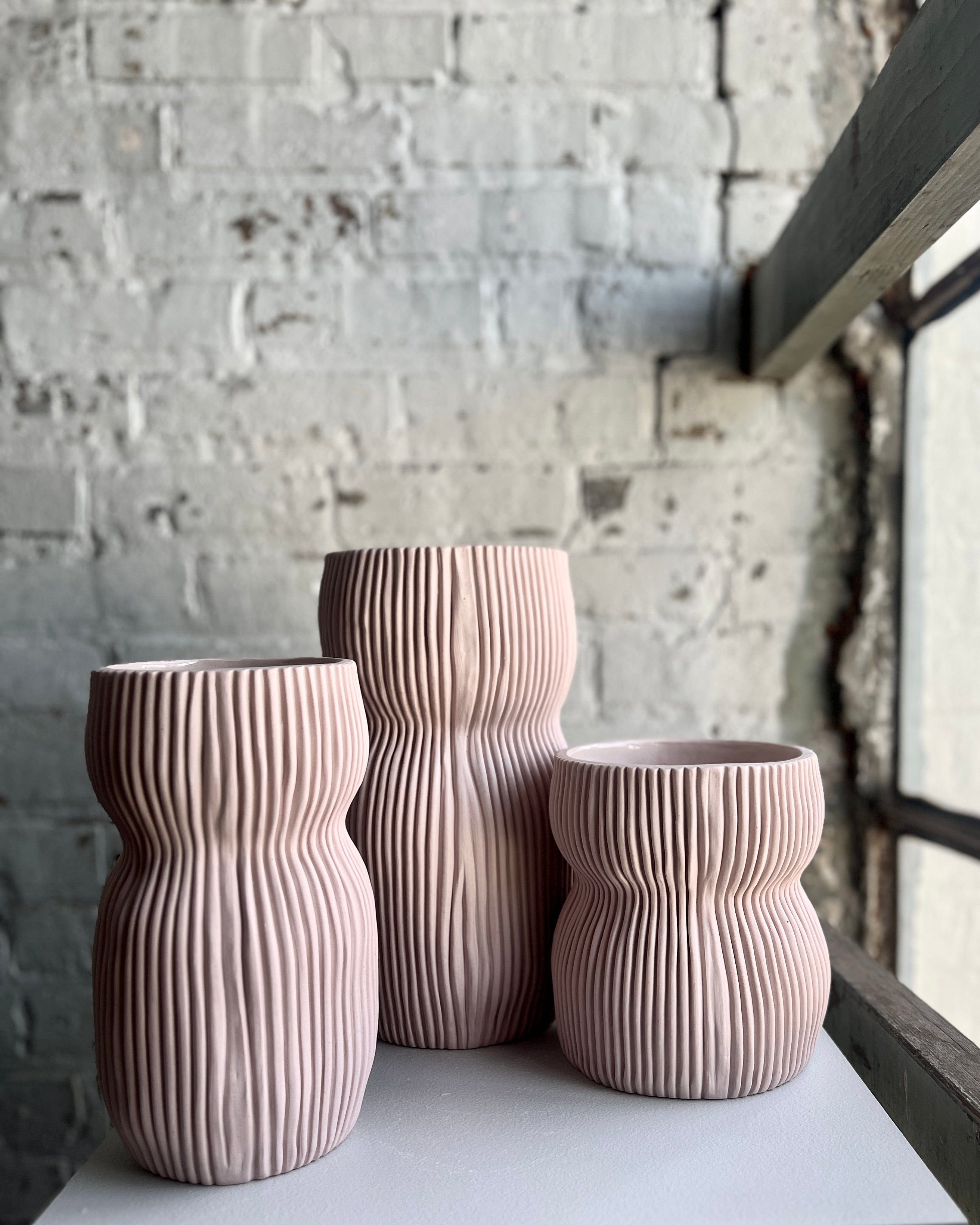 Pink ribbed vases, 5C5F2F16-1EE7-488B-B3C2-C40A27A17B98