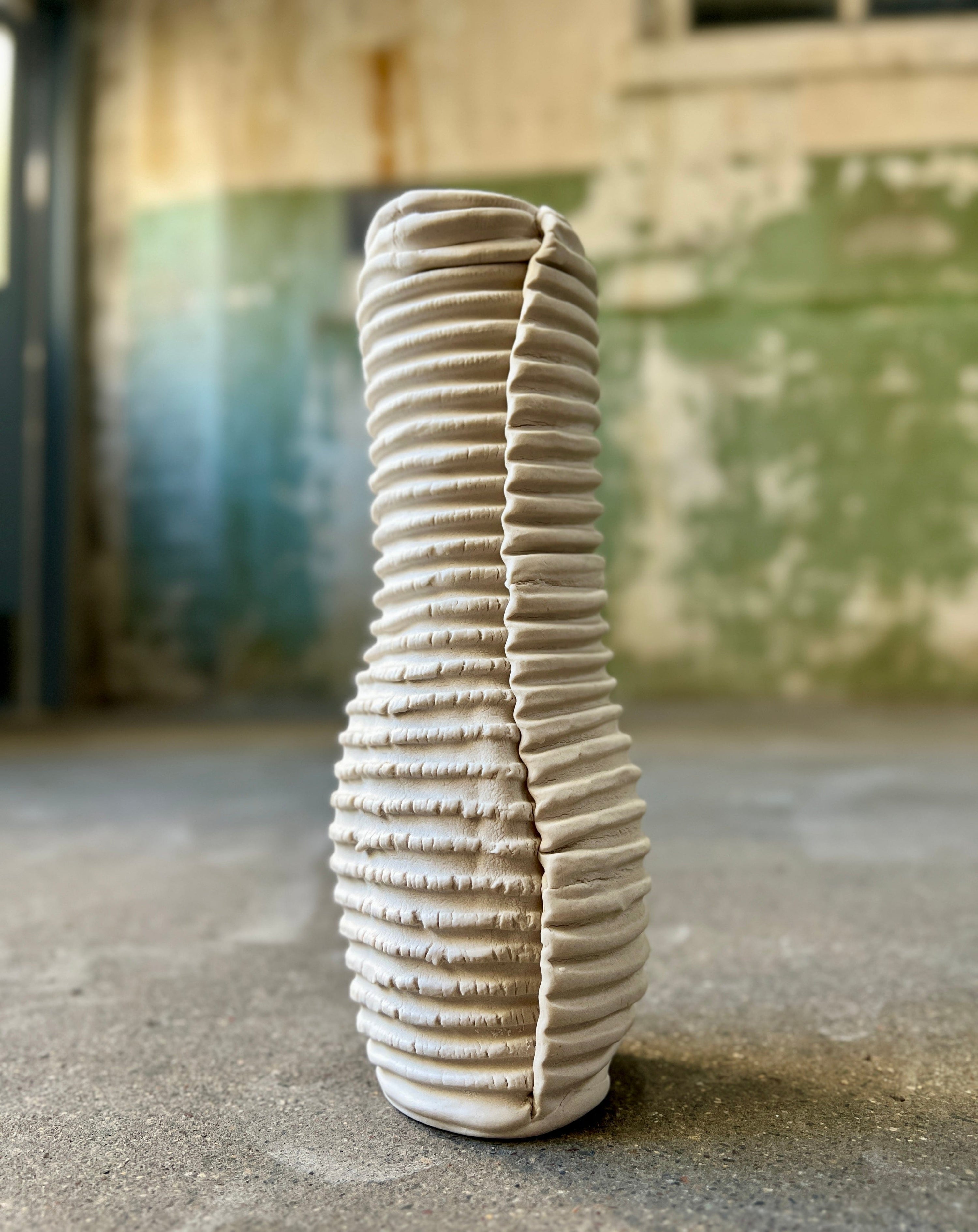 White textured ceramic vase.