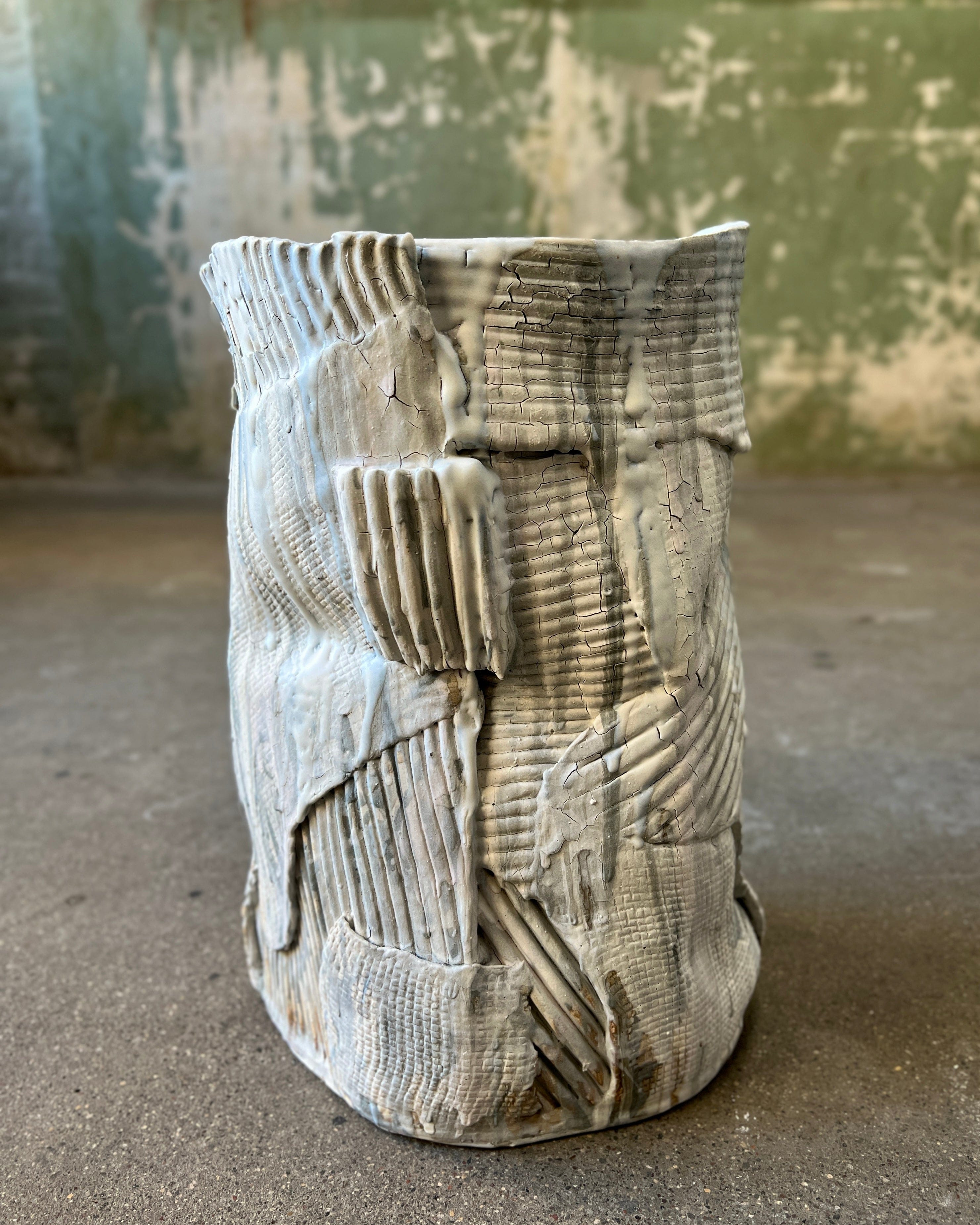 Textured, white ceramic vase.