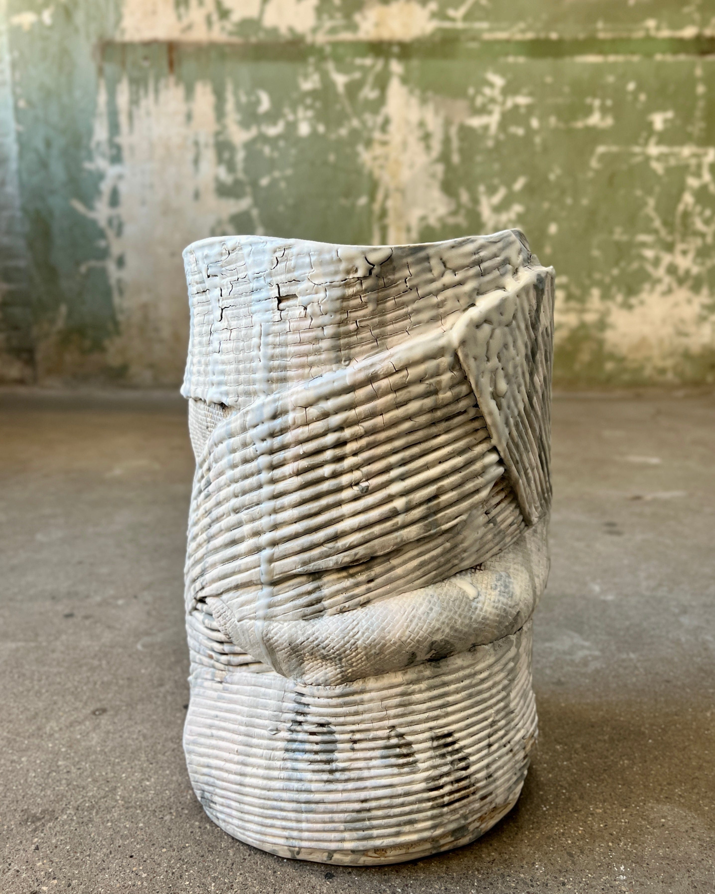 Textured white ceramic vase.