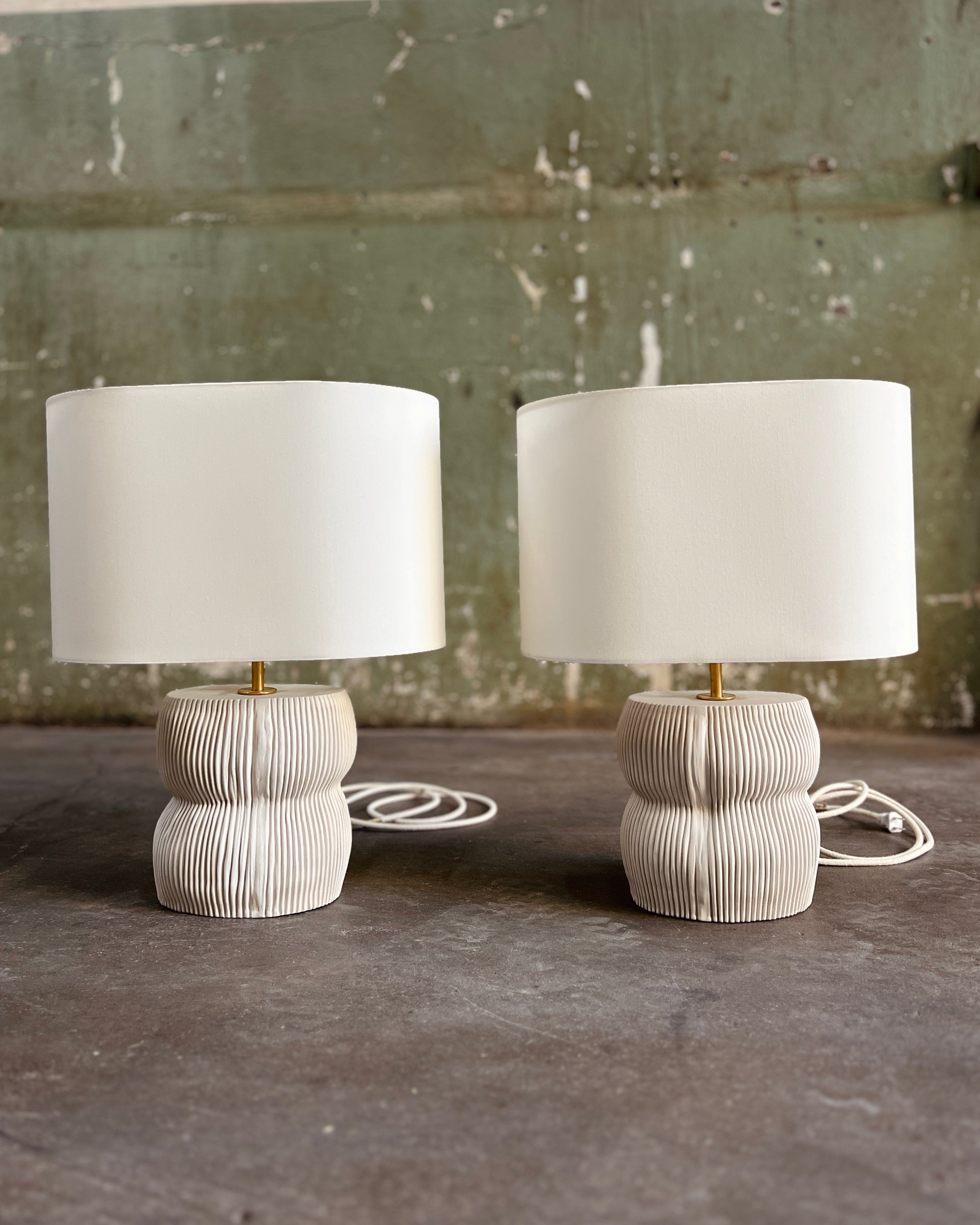 Two white table lamps.